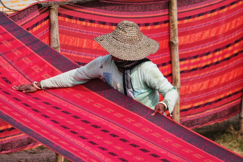 a woman carrying large blankets with her feet on it