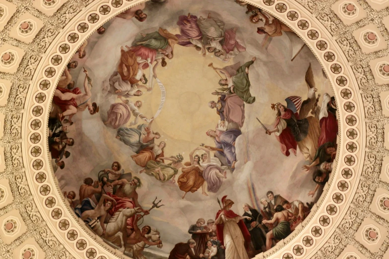 a dome ceiling with a painting and a bunch of statues