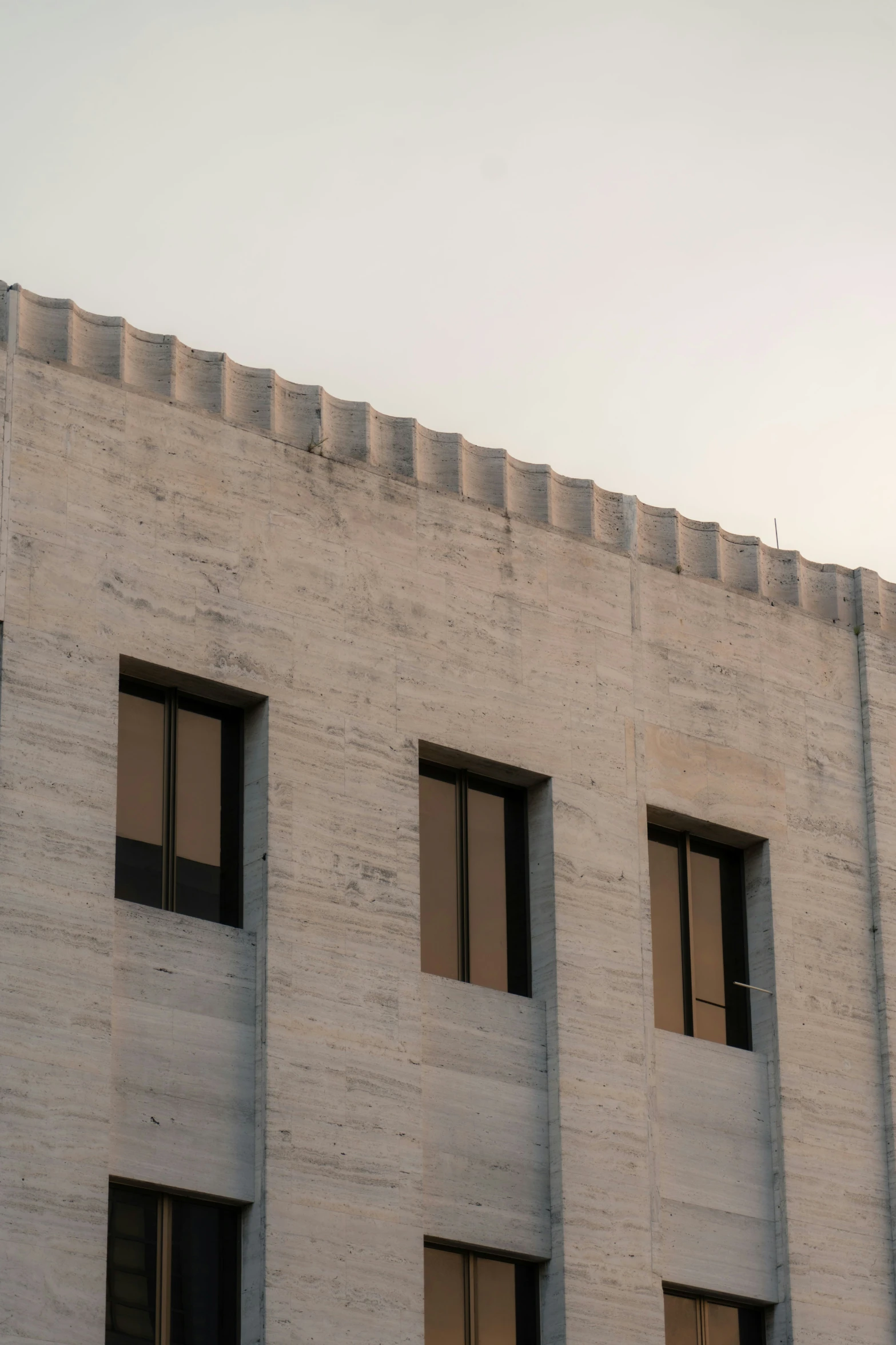 an odd brick building with four windows