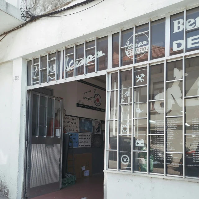 the front entrance to a restaurant with windows