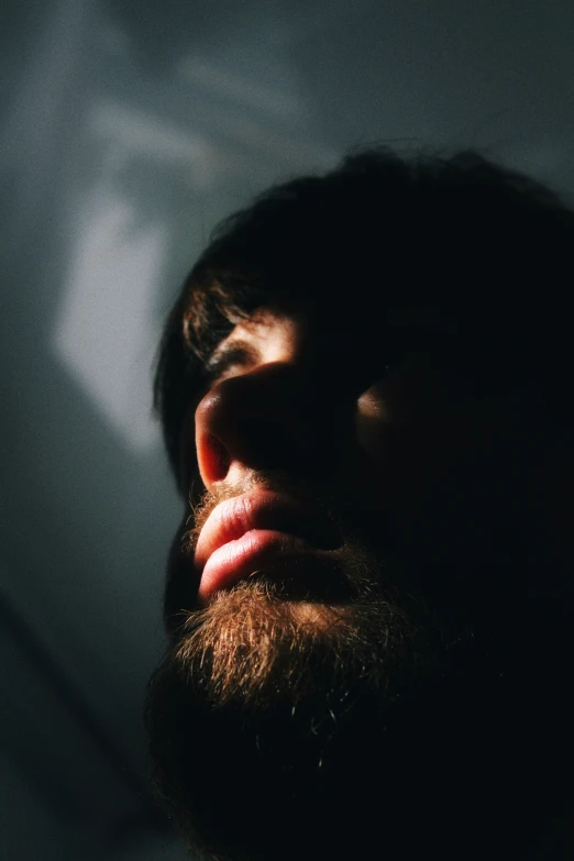 a close up of a man with his head in his hands