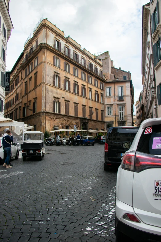 there is a busy street with many shops