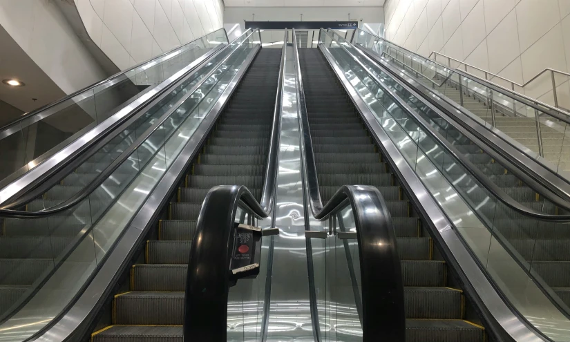 two escalators going up to an upper level