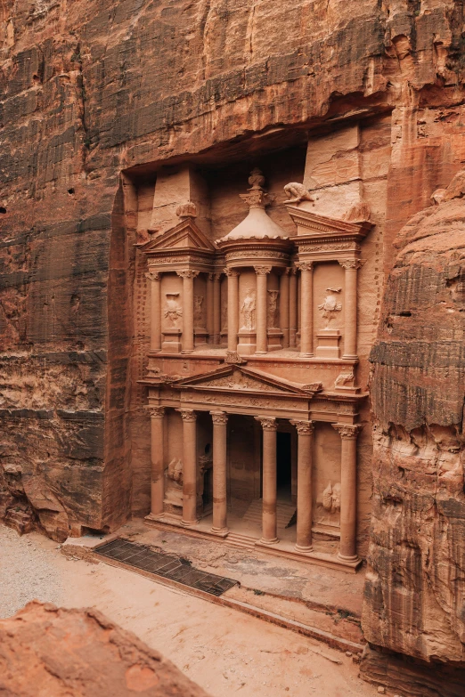 ancient carved stone carvings at the base of a cliff