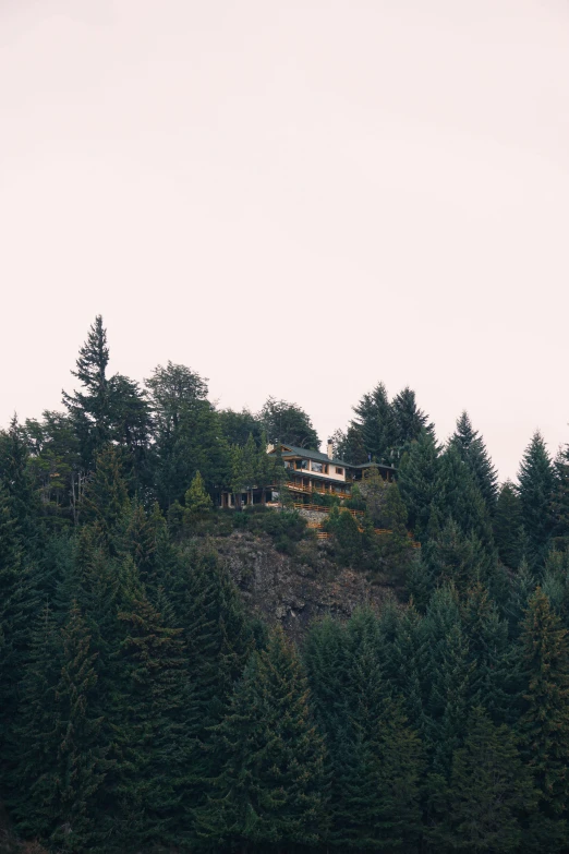 a hill with a house sitting on top of it