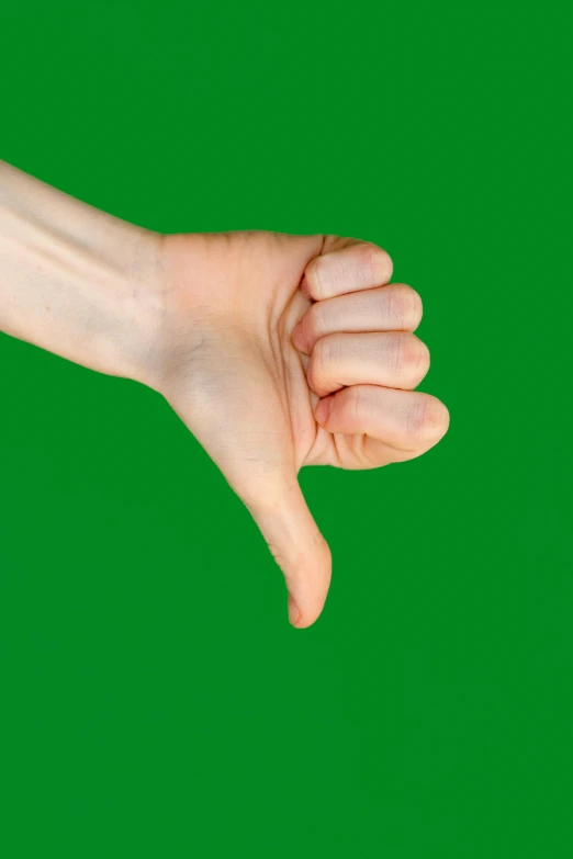 a green background shows a hand with an index finger