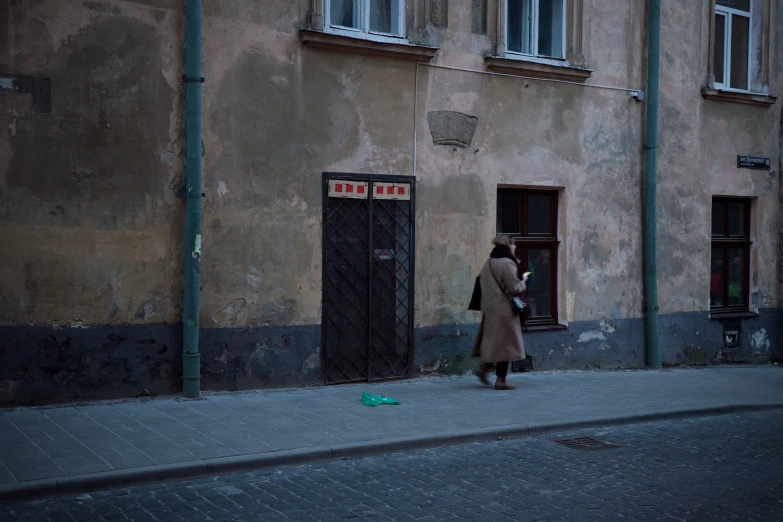 a person standing outside of an old building