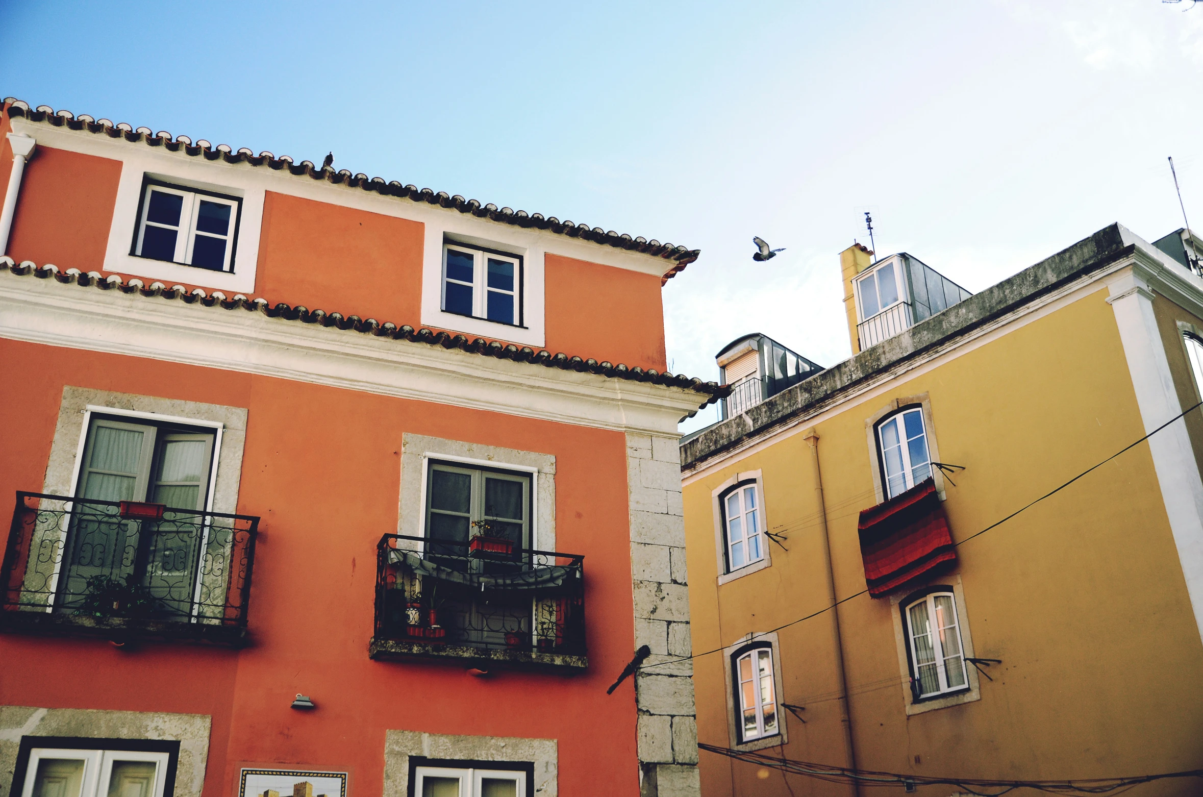 an image of two buildings that are colored orange