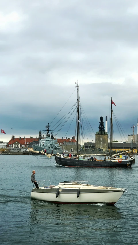 a boat on the water and other boats in the distance