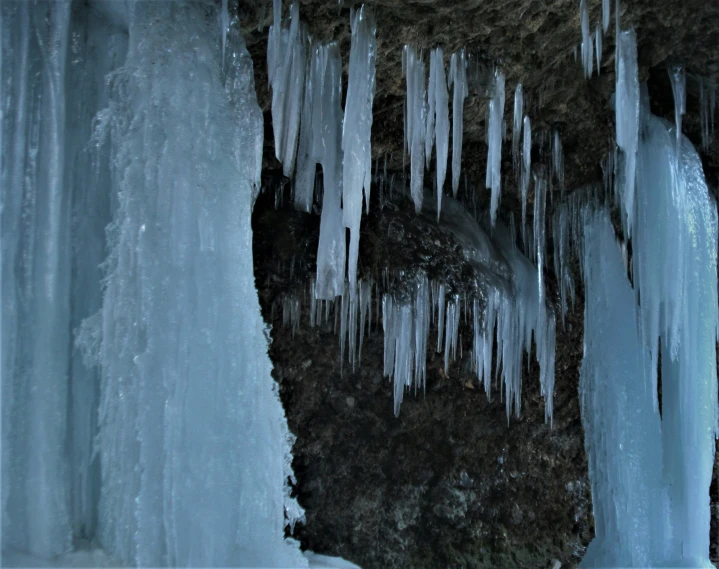 icicles hanging down off the side of a mountain