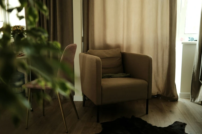 the inside of a house with a brown chair