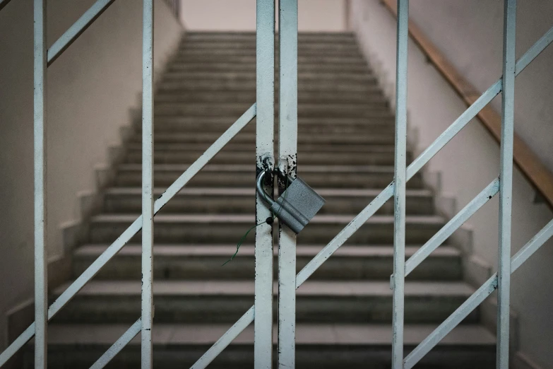 a door with a handle on it in front of an outside stairway