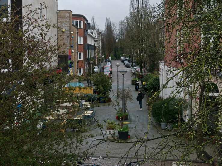 an empty street has a bicycle parked on the side