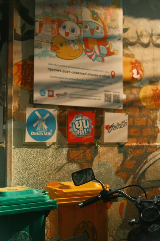 a bicycle parked outside of a building with posters in the back