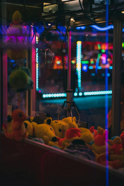 a large pile of winnie the pooh stuffed toys are for sale at the carnival