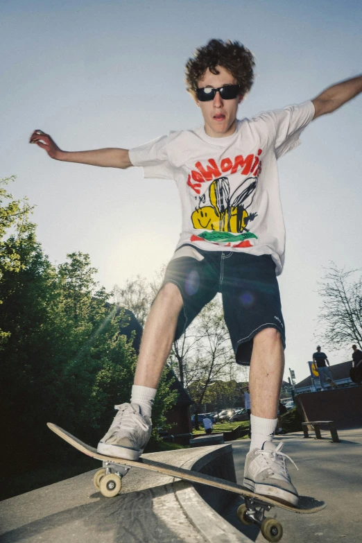 man with skateboard on cement surface during daytime