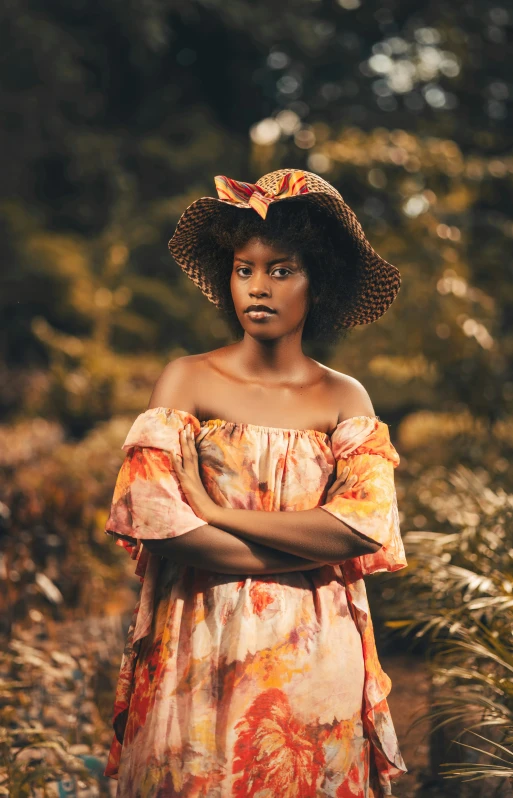 a woman with large hair wearing a hat with a flower on it