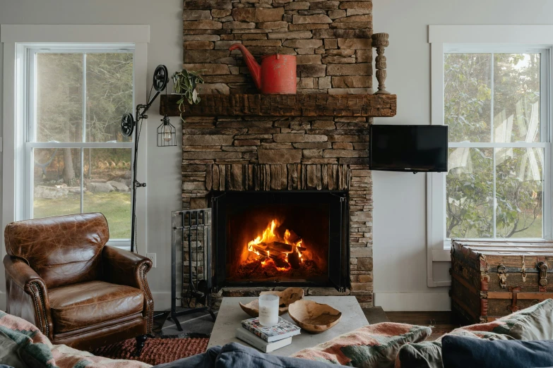 a room filled with furniture and a brick fire place