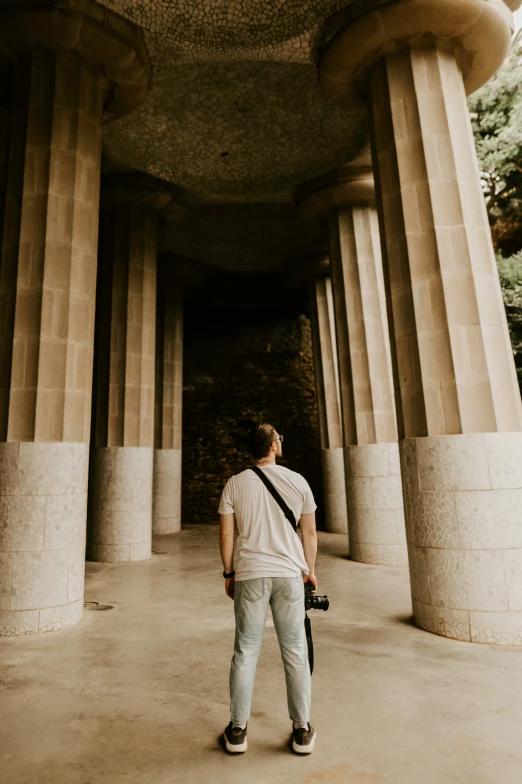 a man is standing in the middle of an old building