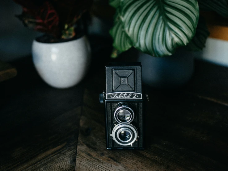 a camera sitting on top of a wooden table