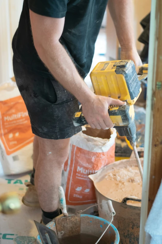 a person sanding in the process of a project