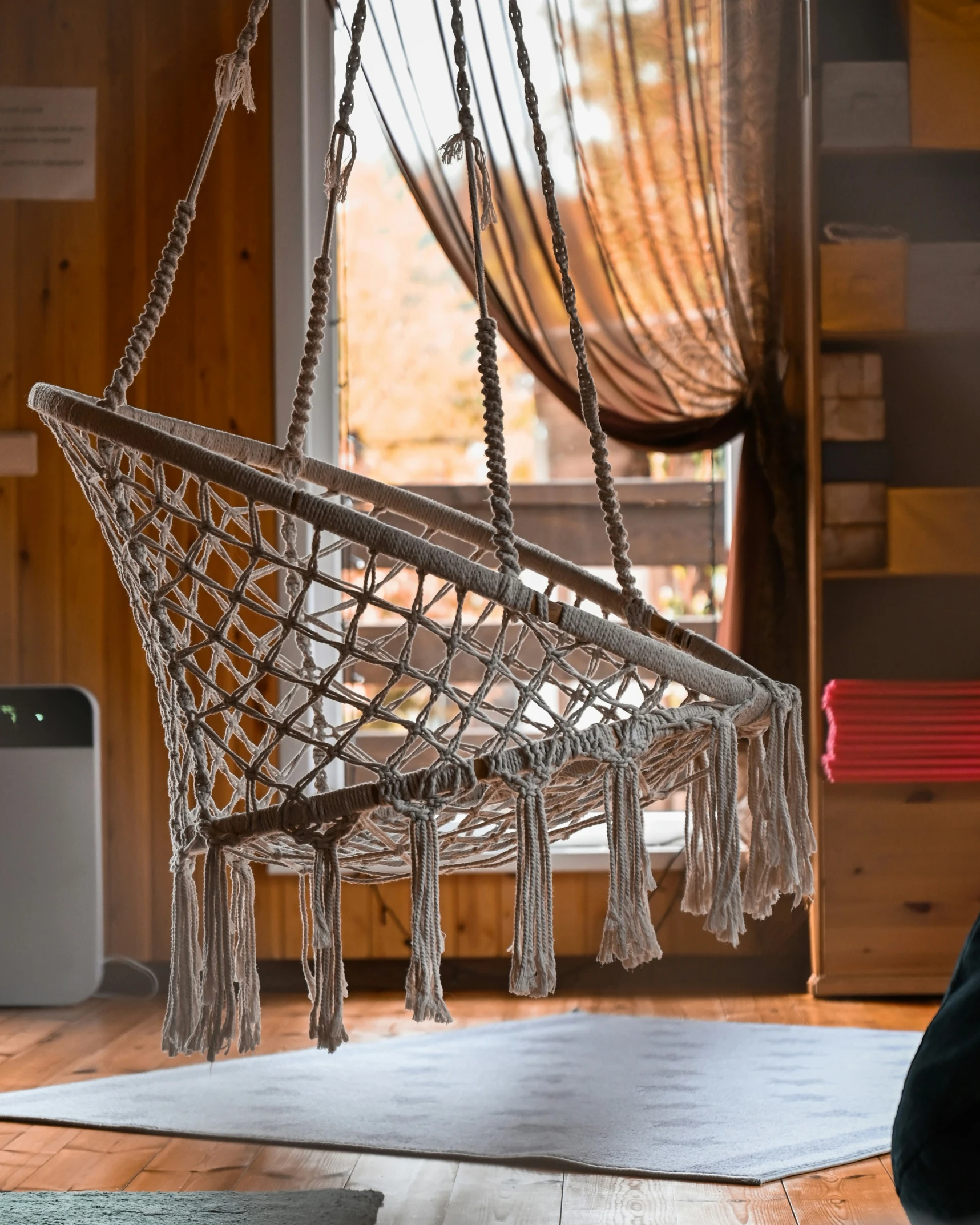 a hammock hanging from the ceiling by rope