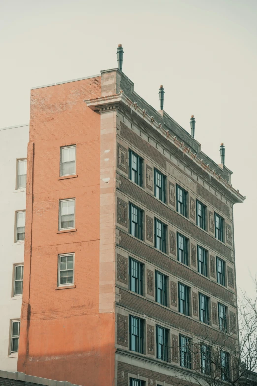 an old building with windows in an urban setting