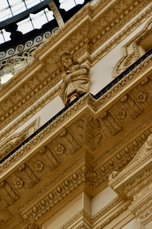 a fancyly detailed architectural detail surrounds the facade of an old cathedral