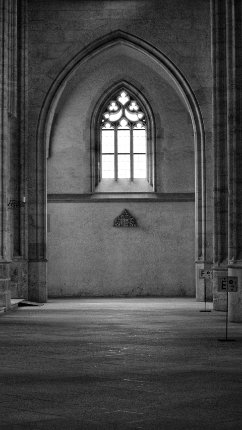 an old building with a very large window