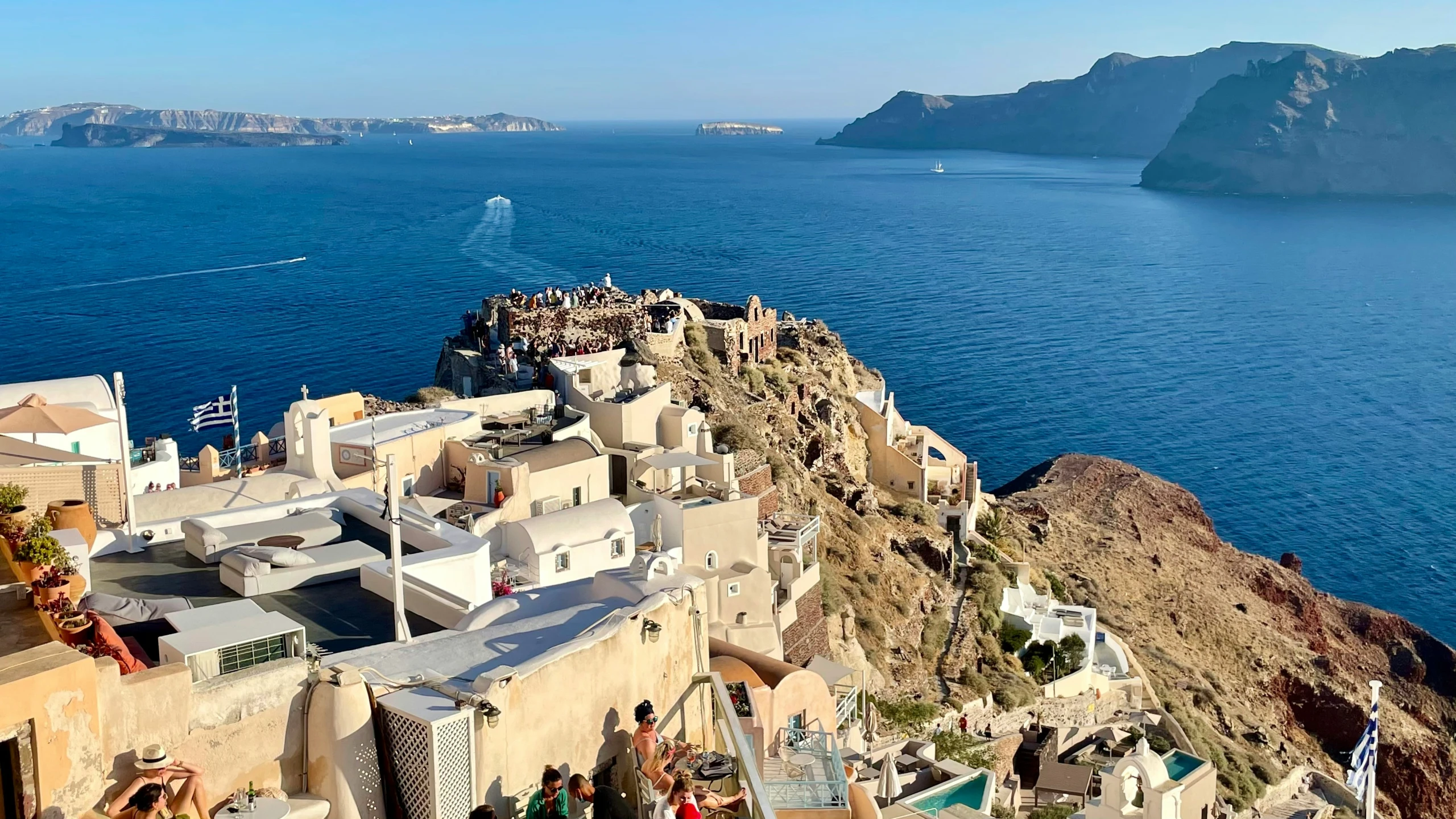 a large number of small houses on the edge of water