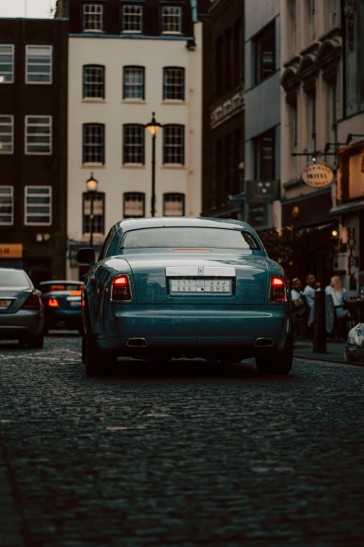 a car on a city street at sunset