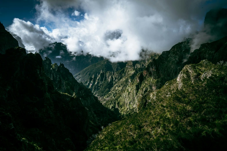 a view of mountains from the bottom of a steep