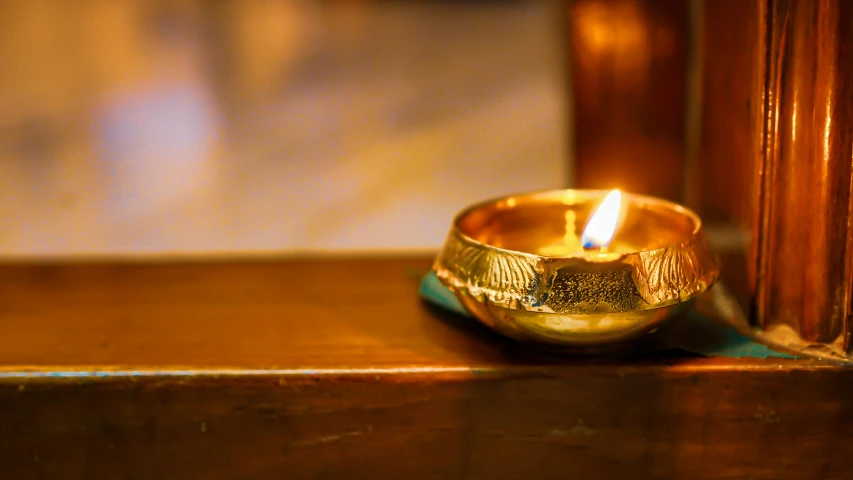 a close up of a candle on a table