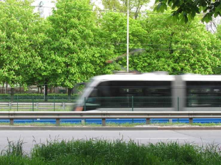 a train moving along side of a road