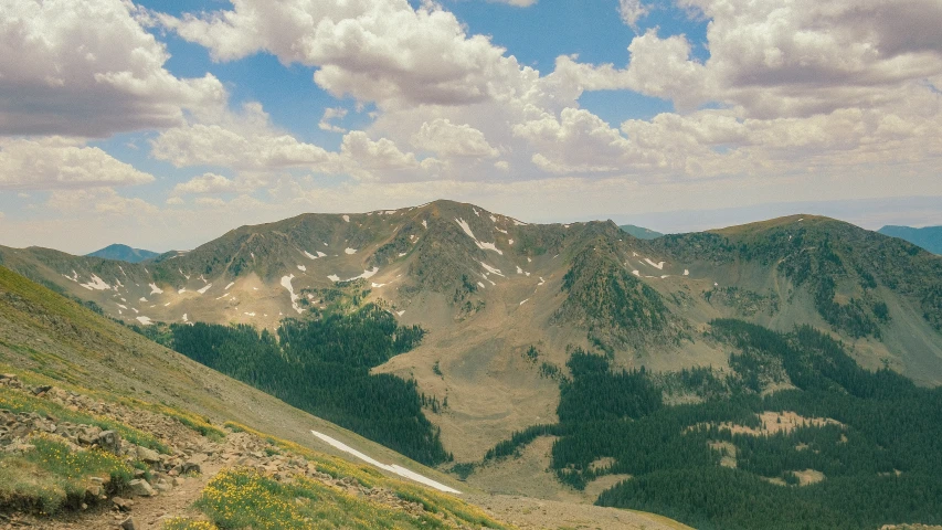 the view of the mountains from above and in mid - morning