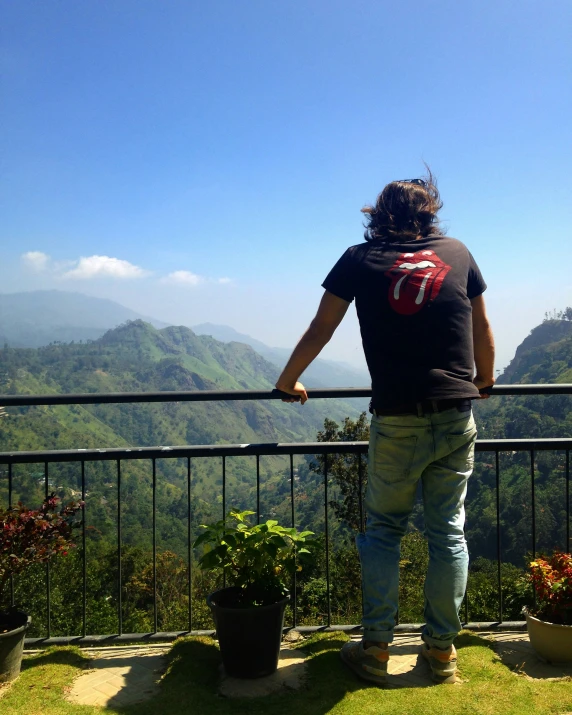 a person that is looking out over the mountains