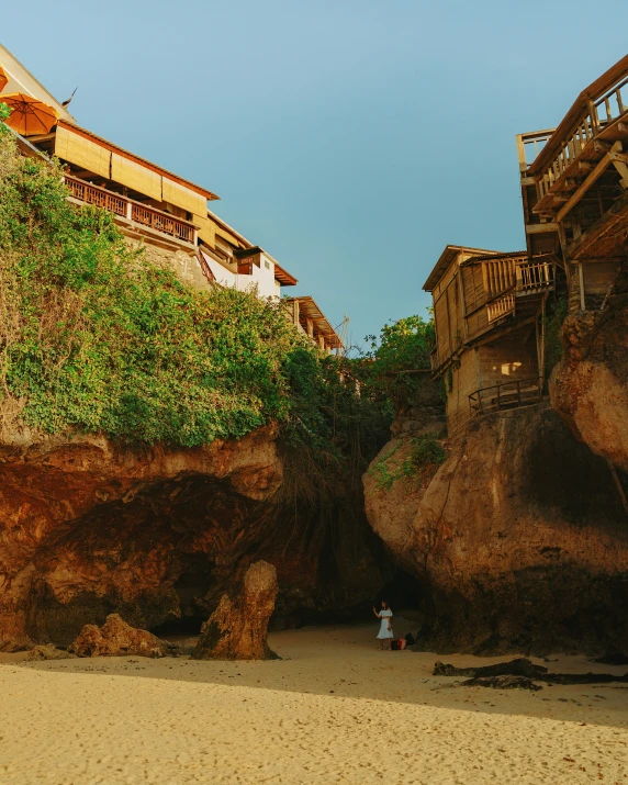 an old town sits in the middle of a beach