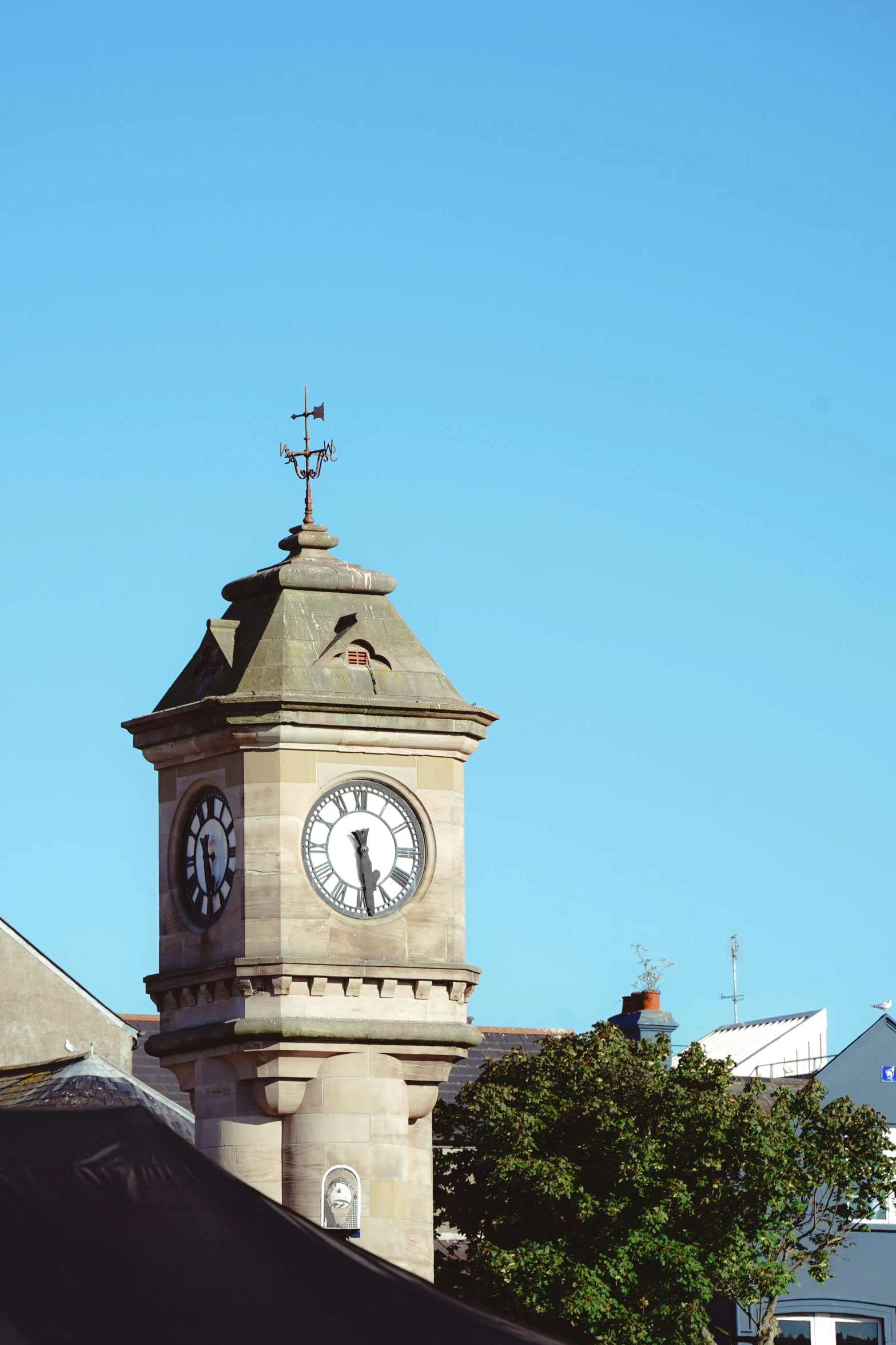 a clock on a tower on a sunny day