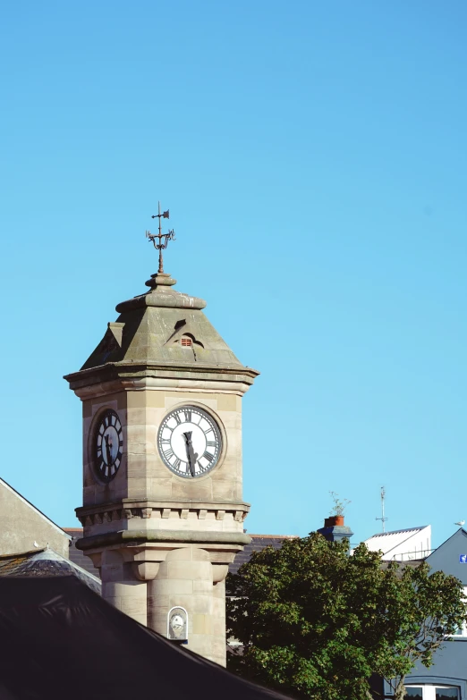 a clock on a tower on a sunny day