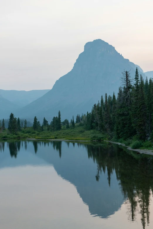 this is a lake surrounded by mountains and trees