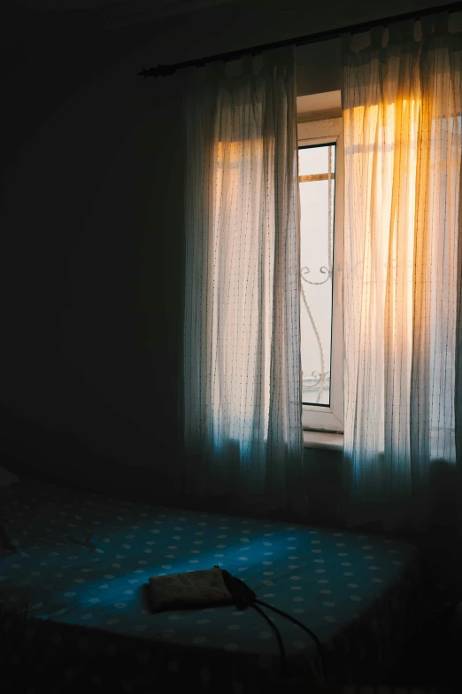 light coming in through a window onto a bed