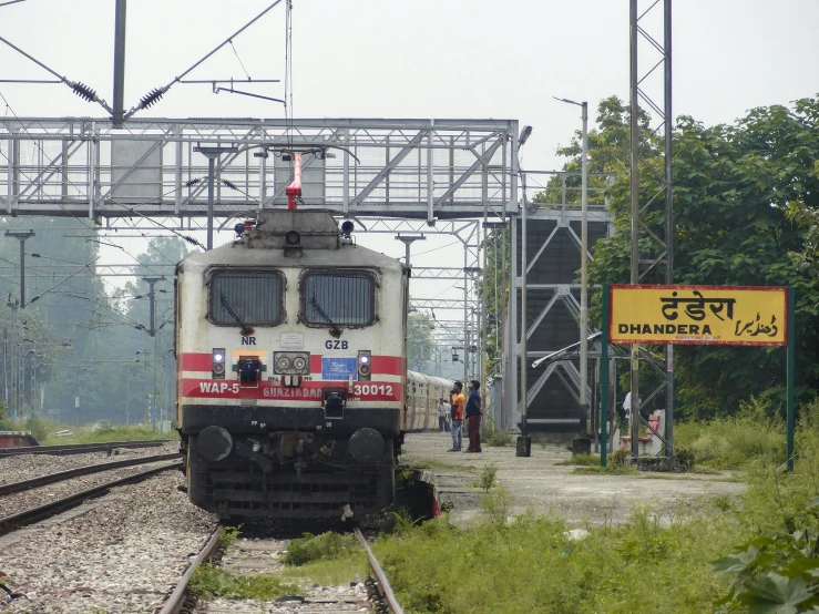 a train coming to a stop in the middle of nowhere