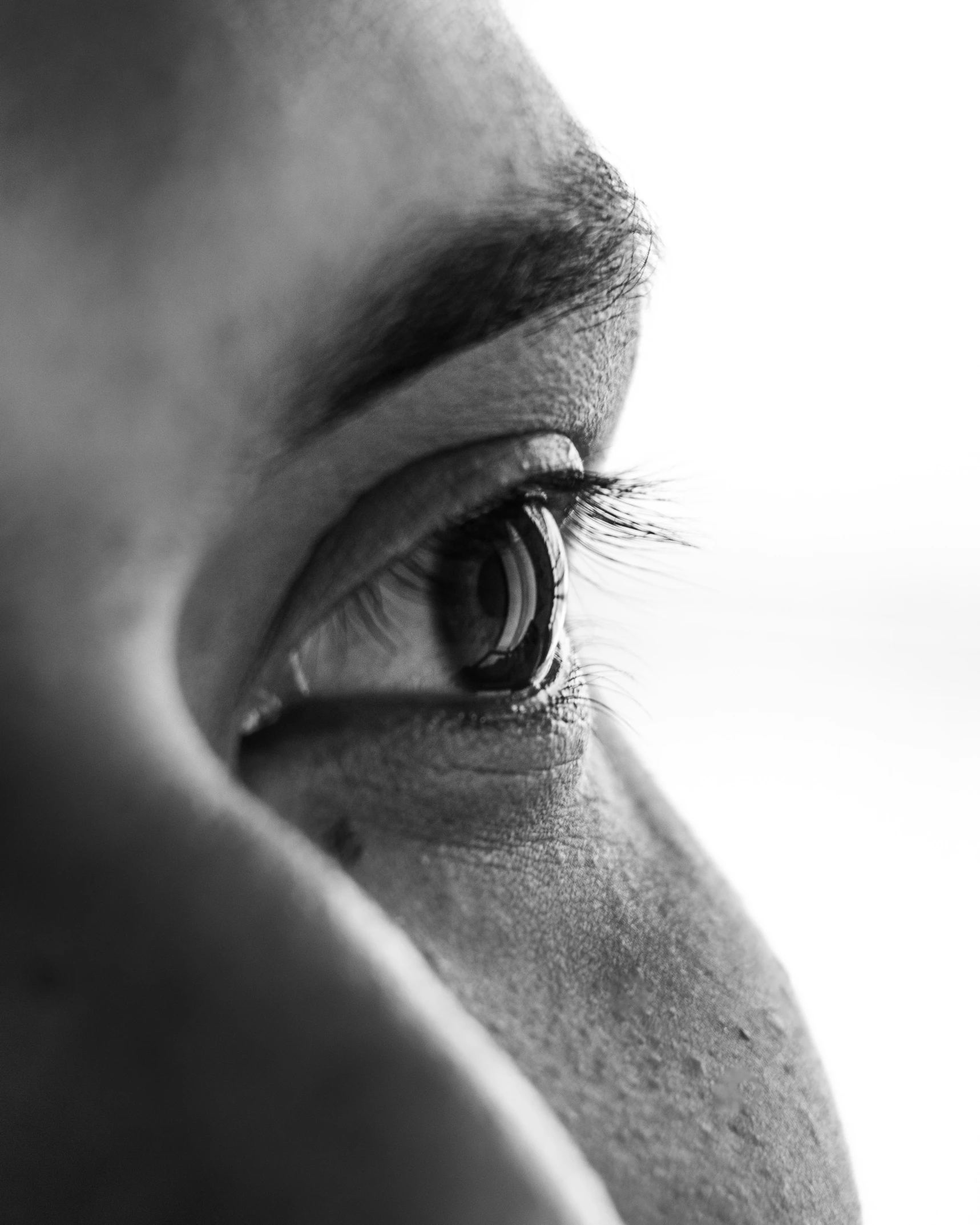 black and white pograph of someone with a contact lens