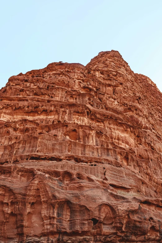 a mountain of rocks has a sky background