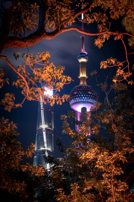 fireworks lit up the night sky behind two towers