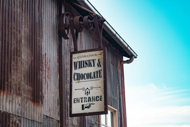 a close up of a street sign on a building