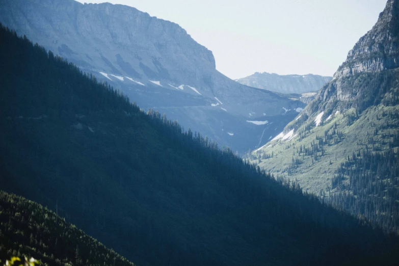 a view from the top of a mountain looking down into a valley