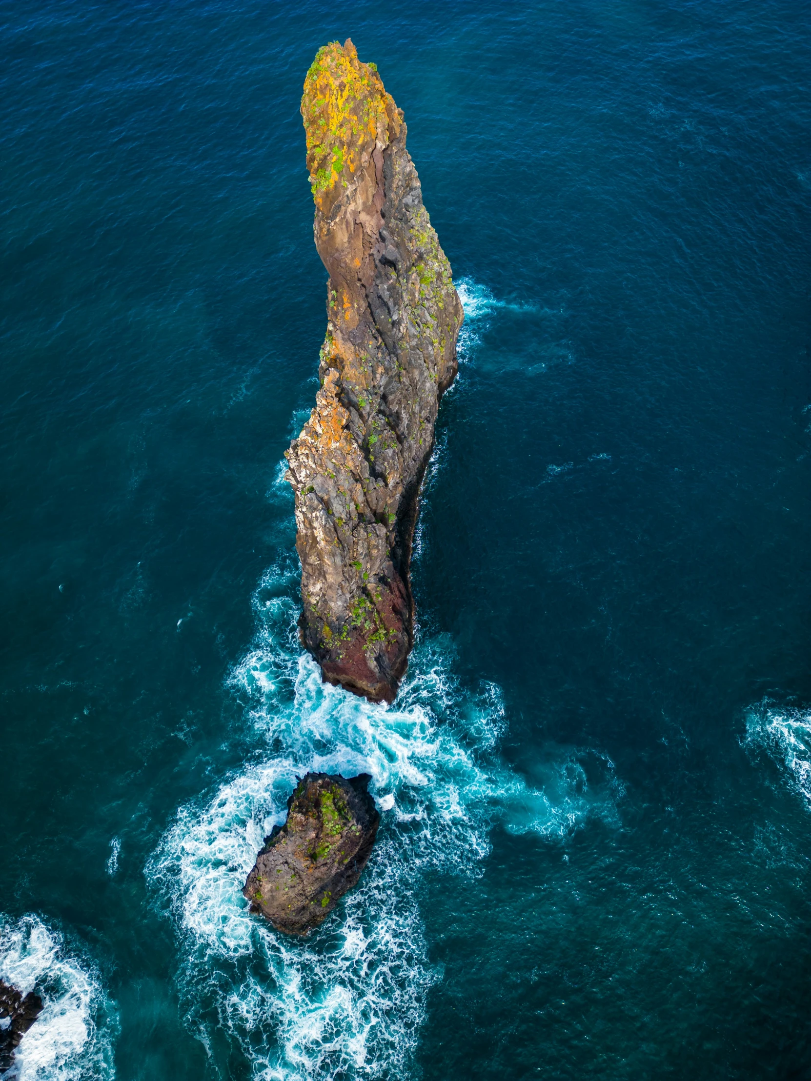 an island with a cliff near the water