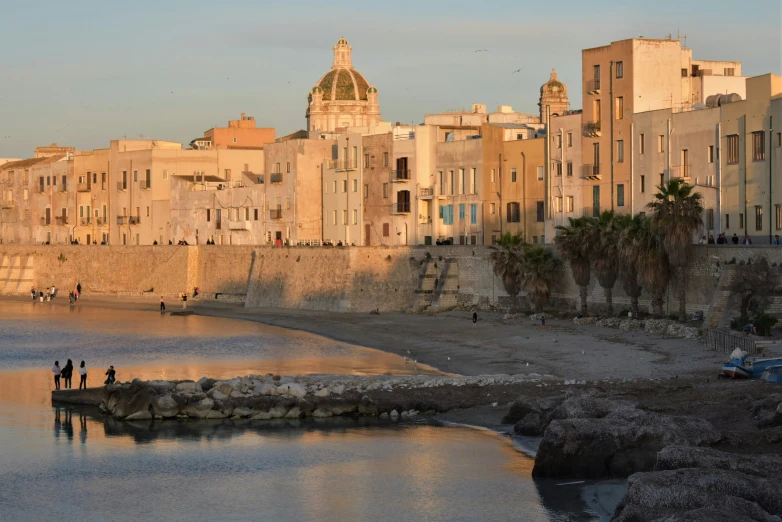 an old town that is sitting next to the beach