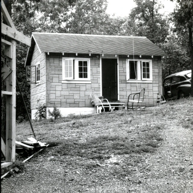 a house that has a chair sitting next to it